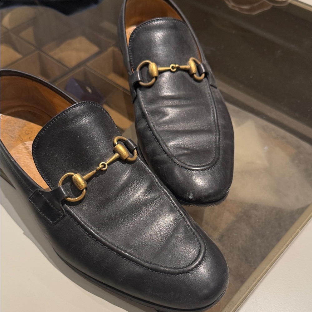 Gucci Black Leather Slip-Ons with Gold Accents worn once like new